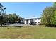 Two story condo building with well manicured lawn and ample parking on a bright sunny day at 22441 Westchester Blvd # 1100C, Punta Gorda, FL 33980