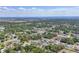 Areal shot of dense neighborhood surrounded by green forests and a view of the nearby ocean at 23239 Stelling Ave, Punta Gorda, FL 33980