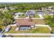 Aerial of backyard showcasing pool, patio, and fenced yard at 23239 Stelling Ave, Punta Gorda, FL 33980