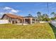 Spacious backyard with an outdoor kitchen and screened-in pool at 23239 Stelling Ave, Punta Gorda, FL 33980