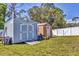 Backyard features 2 sheds for storage and ride on lawn mower at 23239 Stelling Ave, Punta Gorda, FL 33980