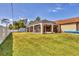 Expansive backyard featuring a screened pool enclosure and storage shed at 23239 Stelling Ave, Punta Gorda, FL 33980