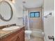 Full bathroom featuring a tub-shower combo, single vanity, and tile floors at 23239 Stelling Ave, Punta Gorda, FL 33980