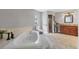 Bright bathroom featuring a soaking tub, walk-in shower, and modern fixtures at 23239 Stelling Ave, Punta Gorda, FL 33980
