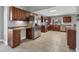 Spacious kitchen featuring stainless steel appliances, wood cabinets, and tile flooring at 23239 Stelling Ave, Punta Gorda, FL 33980