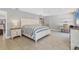 Bright bedroom featuring tile flooring, ceiling fan, and access to the outdoor patio at 23239 Stelling Ave, Punta Gorda, FL 33980