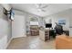 Office area features a desk, TV, chair, and large window allowing natural light at 23239 Stelling Ave, Punta Gorda, FL 33980