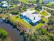 Aerial view of waterfront estate with pool, patio, and private dock at 27320 Egret Pl, Punta Gorda, FL 33983