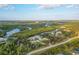 Expansive aerial shot of waterfront property, capturing the home and scenic surroundings at 27320 Egret Pl, Punta Gorda, FL 33983