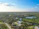 Expansive aerial view of the property and surrounding landscape, showcasing waterfront and community at 27320 Egret Pl, Punta Gorda, FL 33983