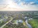Beautiful aerial view of the home, surrounded by nature, with a dock on the water at 27320 Egret Pl, Punta Gorda, FL 33983