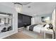 Beautiful bedroom with a dark accent wall, large windows, and modern décor at 27320 Egret Pl, Punta Gorda, FL 33983