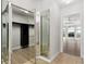 Mirrored walk-in closet with custom shelving and storage, adjacent to bright bedroom at 27320 Egret Pl, Punta Gorda, FL 33983