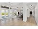 Dining room with modern decor, recessed lighting, wood floors, and views of the backyard at 27320 Egret Pl, Punta Gorda, FL 33983