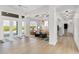 Bright living room featuring wood floors, recessed lighting, and views of the backyard at 27320 Egret Pl, Punta Gorda, FL 33983