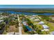 Beautiful aerial view of a landscaped home with a private pool and access to canals at 28482 Coco Palm Dr, Punta Gorda, FL 33982
