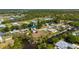 Aerial view of a charming waterfront community with mature trees and picturesque surroundings at 28482 Coco Palm Dr, Punta Gorda, FL 33982