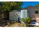 An outdoor storage shed and rain water tank in the backyard for collecting rain water at 28482 Coco Palm Dr, Punta Gorda, FL 33982