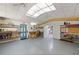 Spacious basement area with ample shelving, work surfaces and easy access to an exit door at 28482 Coco Palm Dr, Punta Gorda, FL 33982