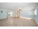 Spacious bedroom boasts tiled floors, ample wardrobe space, and neutral decor at 28482 Coco Palm Dr, Punta Gorda, FL 33982