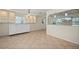 Open-concept dining room features custom lighting, tile floors, and built-in cabinetry for ample storage at 28482 Coco Palm Dr, Punta Gorda, FL 33982