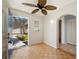Welcoming entryway featuring parquet floors, ceiling fan, arched doorway, and open view to a well landscaped front at 28482 Coco Palm Dr, Punta Gorda, FL 33982