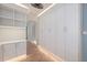 Hallway featuring built-in storage cabinets and neutral decor at 28482 Coco Palm Dr, Punta Gorda, FL 33982