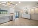 Bright kitchen features stainless steel appliances, tile floors, recessed lighting, custom cabinetry, and access to the lanai at 28482 Coco Palm Dr, Punta Gorda, FL 33982