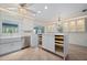 Bright, renovated eat-in kitchen with stainless steel appliances, center island, custom cabinetry, and tile floors at 28482 Coco Palm Dr, Punta Gorda, FL 33982