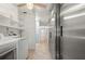 Spacious laundry room features modern appliances, ample cabinetry, and extended storage space at 28482 Coco Palm Dr, Punta Gorda, FL 33982