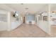 Spacious living room features tile flooring, custom built-ins, and is open to kitchen through arched opening at 28482 Coco Palm Dr, Punta Gorda, FL 33982