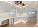 Office showcasing custom built-in desk, storage, and shelving with overhead lighting at 28482 Coco Palm Dr, Punta Gorda, FL 33982