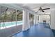 Florida room overlooking a screened-in pool with an outdoor seating area at 28482 Coco Palm Dr, Punta Gorda, FL 33982