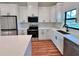 Well-appointed kitchen boasting stainless steel appliances, quartz countertops, and ample cabinet space at 2920 Barry Rd, North Port, FL 34286