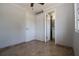 A simple bedroom with neutral walls, and tile flooring at 351 S Mccall Rd, Englewood, FL 34223