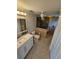 Bathroom with accessible shower, white vanity, and tile flooring at 529 Belvedere Ct, Punta Gorda, FL 33950