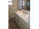 Bathroom vanity with white cabinets, modern sink, and stylish fixtures, offering ample storage at 529 Belvedere Ct, Punta Gorda, FL 33950