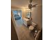 Bathroom leading to bedroom with white vanity, toilet, and tile flooring at 529 Belvedere Ct, Punta Gorda, FL 33950