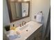 Bathroom vanity with white cabinets, modern sink, and stylish fixtures, offering ample storage at 529 Belvedere Ct, Punta Gorda, FL 33950