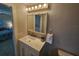 Bathroom features a white vanity, mirrored cabinet, and tile floors at 529 Belvedere Ct, Punta Gorda, FL 33950