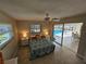 Bedroom featuring tile flooring, neutral colors, and a pool view at 529 Belvedere Ct, Punta Gorda, FL 33950