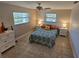 Bright bedroom with neutral walls, patterned bedding, and a white dresser providing ample storage at 529 Belvedere Ct, Punta Gorda, FL 33950