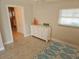 Bedroom featuring a white dresser and tile floors, offering a clean and functional space at 529 Belvedere Ct, Punta Gorda, FL 33950