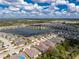 Expansive aerial perspective of a home in a beautiful community with lake views at 7393 West Lenox Cir, Punta Gorda, FL 33950