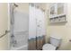Bathroom showing bath tub with shower, toilet and storage at 7393 West Lenox Cir, Punta Gorda, FL 33950