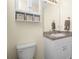 Bathroom featuring vanity with storage and hardware, plus a toilet at 7393 West Lenox Cir, Punta Gorda, FL 33950