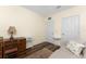 Office area features wood desk, sofa and hardwood floors at 7393 West Lenox Cir, Punta Gorda, FL 33950