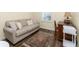 Comfortable bedroom with a neutral color scheme, a window with blinds, and a desk area at 7393 West Lenox Cir, Punta Gorda, FL 33950