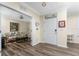 Inviting foyer with hardwood floors, neutral paint, and an entryway to living room at 7393 West Lenox Cir, Punta Gorda, FL 33950