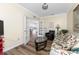 Comfortable sitting room with French doors leading into the bright kitchen at 7393 West Lenox Cir, Punta Gorda, FL 33950